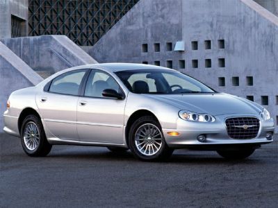 Silver sedan with distinct front grille and multi-spoke alloy wheels