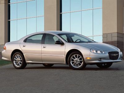 Side profile with chrome wheels and oval headlights of a sedan