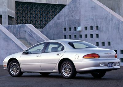 Silver sedan rear side view with iconic taillights and sleek body design
