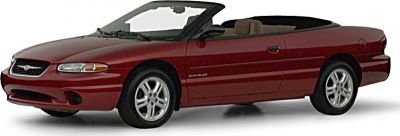 Red convertible with beige interior and alloy wheels