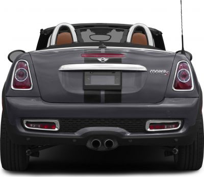 Rear view with dual exhaust, roll bars, and distinctive taillights