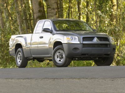 Extended cab pickup truck front and side view with rugged styling