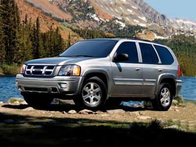 Silver SUV in front side view with mountain background