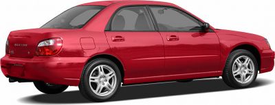 Side view of red sedan with alloy wheels