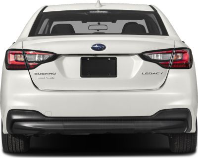 Rear view of sedan with AWD badge and distinct taillights