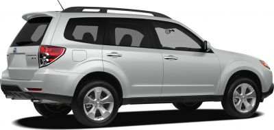 Rear side view of a silver SUV with roof rails and alloy wheels