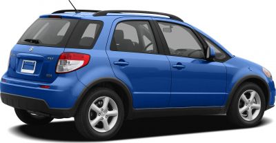 Rear side view of blue compact crossover with roof rails and alloy wheels