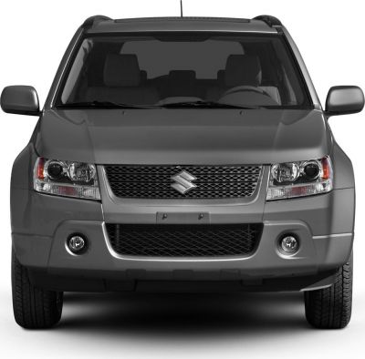 Front view with dual headlights and mesh grille