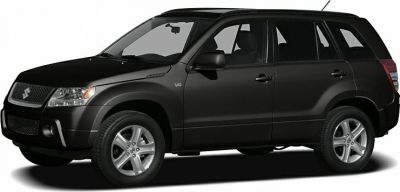 Side view of black SUV with V6 badge and alloy wheels.
