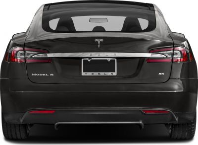 Rear view with taillights, chrome trim, and rear fascia of an electric sedan.