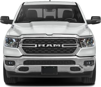 bold grille and aggressive headlights of a modern pickup truck front