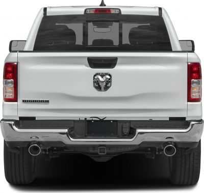Pickup rear view with tailgate, chrome bumper, dual exhaust, and RAM emblem