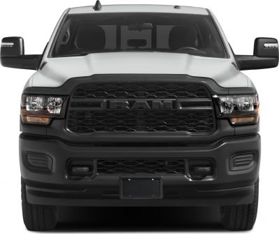 Front view showing grille, headlights, and mirrors of a heavy-duty pickup truck.