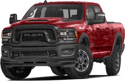Robust black front grille and all-terrain tires on rugged pickup