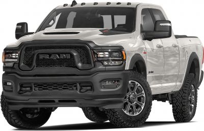 Heavy duty pickup with crew cab, bold grille, dual headlamps, and off-road tires.