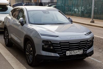 Futuristic grille and slim LED headlights of modern SUV