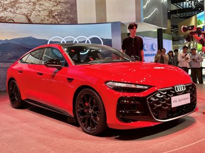 Bold red sportback with dynamic LED headlights and distinctive black alloy wheels
