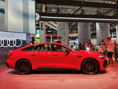 Red sportback side profile with black alloy wheels