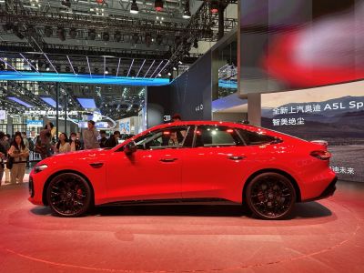 Red sportback with black wheels and aerodynamic side profile