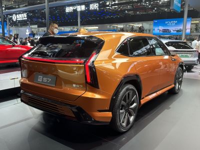 SUV rear corner with bold taillights and sporty wheels in metallic orange