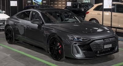 Aerodynamic electric sport sedan with sleek design and black wheels