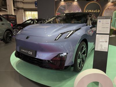 Front view with sleek LED headlights and aerodynamic body design.