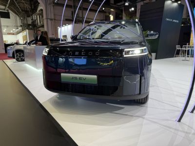 Front view of a sleek electric vehicle with modern LED headlights