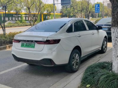 Sleek rear view of electric sedan with streamlined taillights and aerodynamic trunk