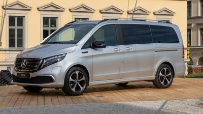 Silver electric MPV side view with sleek design and large windows