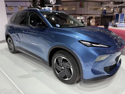 Front side profile with sleek headlights and modern alloy wheels