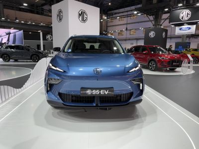 Front view of electric SUV with sleek headlights and bold grille