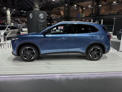 Side profile of electric SUV with aerodynamic body and distinct alloy wheels
