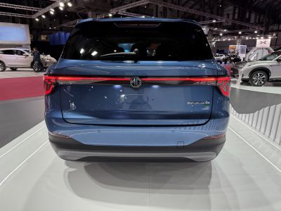 Rear view with full LED tail light bar and hatchback design