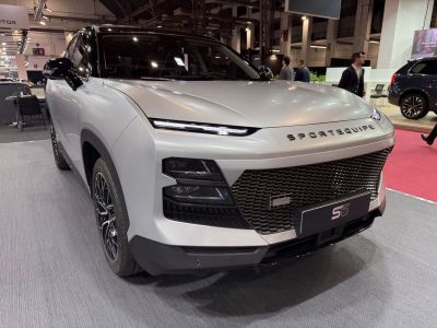 Front grille and slim LED headlights of a modern SUV
