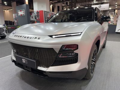 Front with sleek LED headlights and large black grille