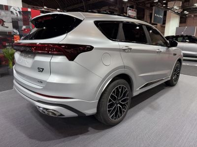 Rear view and alloy wheels of a modern SUV with dual exhaust and tinted windows