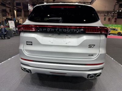 Rear SUV view with quad exhaust and full-width LED taillights