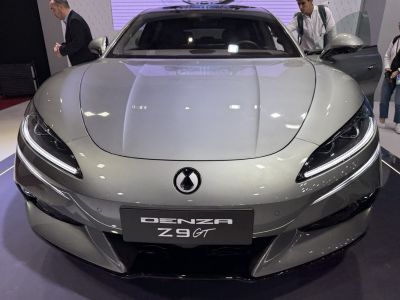 Aerodynamic hood and sharp LED headlights on luxury electric sedan front