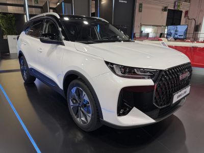 White SUV with black grille and modern alloy wheels
