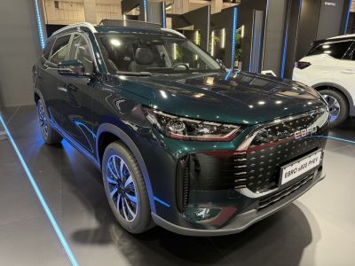 Front view of a sleek SUV with LED headlights and modern grille.