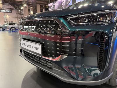 Close-up of car front grille and modern headlight design
