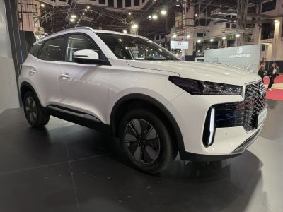 White SUV with distinctive front grille and sleek LED headlights