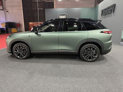Side profile of modern SUV with alloy wheels and two-tone matte finish