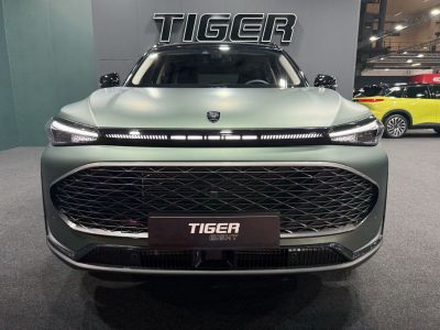 Front view with large grille and LED light strip