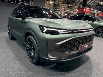 SUV with sharp LED headlights and large diamond-pattern grille