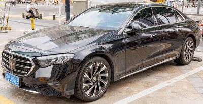 Sleek front-side view with distinctive grille and alloy wheels