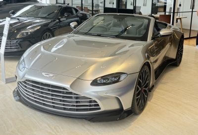 Silver convertible with aggressive front grille and sleek headlights