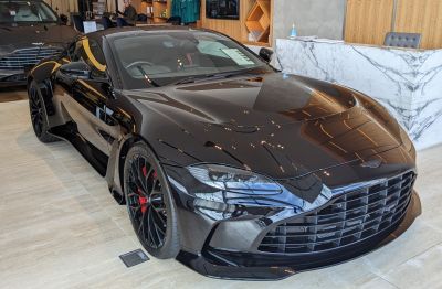 Aerodynamic front with aggressive grille, LED headlights, and black glossy finish