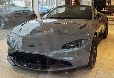 Front view of a sporty luxury convertible with sleek grille and headlights