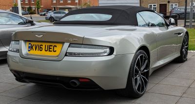 Rear view of convertible with black soft roof and unique tail lights